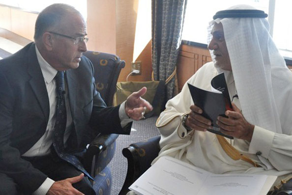 Former Saudi ambassador Prince Turki bin Faisal al-Saud confers with Israeli strategic affairs analyst Yossi Alpher at the National Iranian American Council conference in Washington, Oct. 15, 2013.